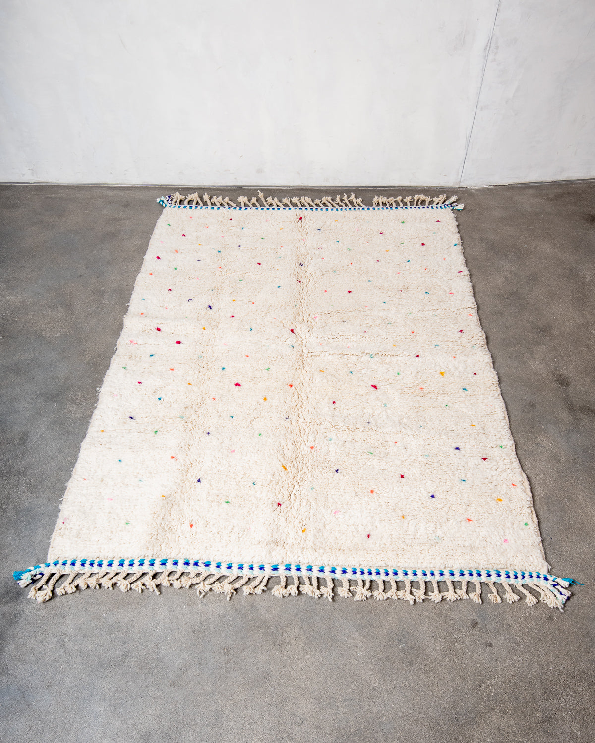 Modern, designer, handcrafted Berber rug from Morocco. Beniourain carpet with beautiful colours and patterns and fluffy wool texture.